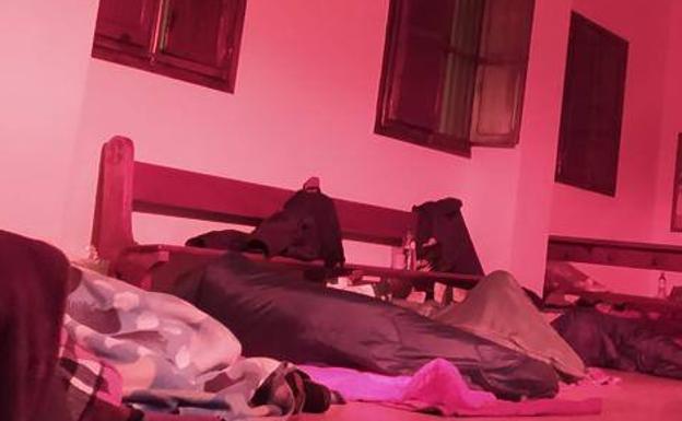 Homeless people sleep on the floor of a church in Valencia because of the lack of beds in shelters